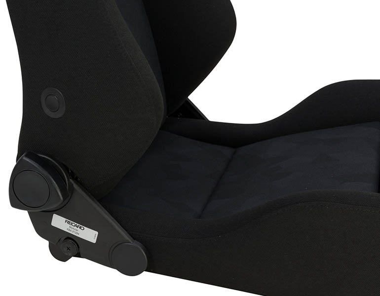 A closeup of where the backrest meets the cushion on the Recaro seat. 