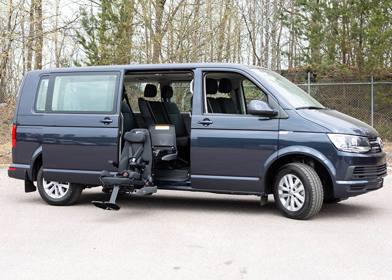 Outward facing child seat in the middle row of a blue van