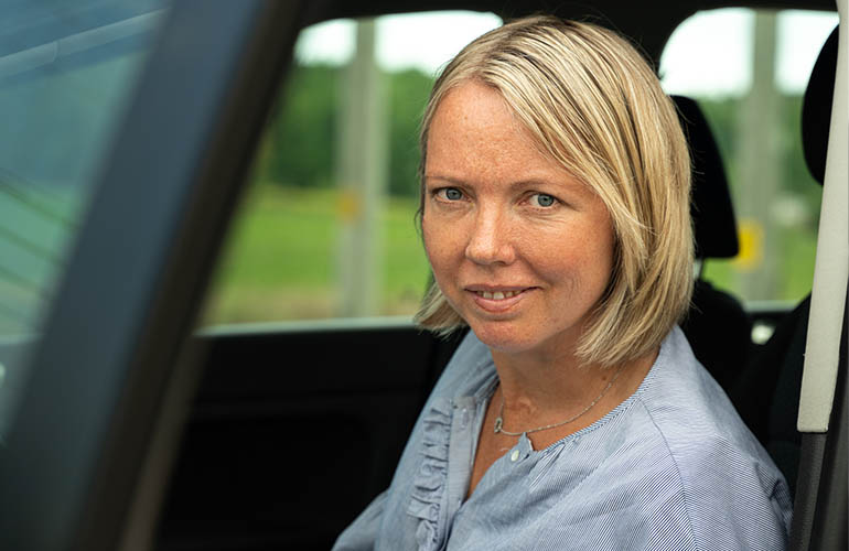 User in her adapted vehicle