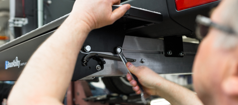 A bolt being tightened on the A-Series mounting bracket.