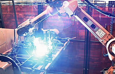 A welding robot in action.   
