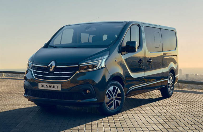 Black Renault van with city in the background