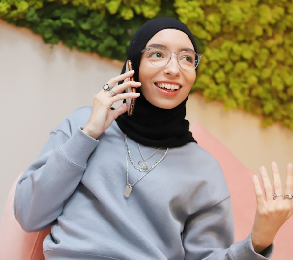 Woman using a telephone.