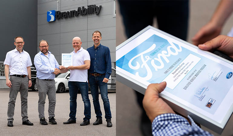 BraunAbility and Ford staff, holding a Ford Qualified Vehicle Modifier certificate