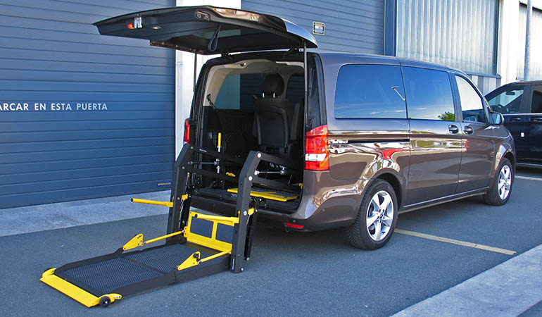 Vehicle with a wheelchair lift installed in the rear.