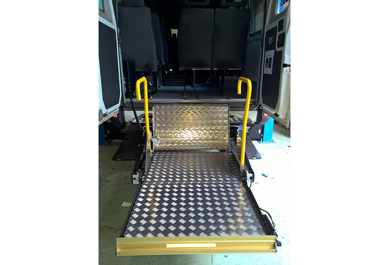 Lift installed on the rear of a mini bus