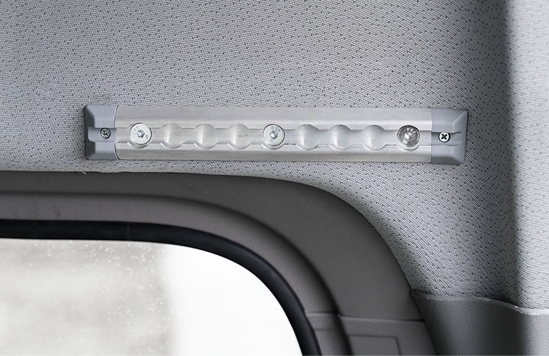 A short piece of rail over the window in a van. 