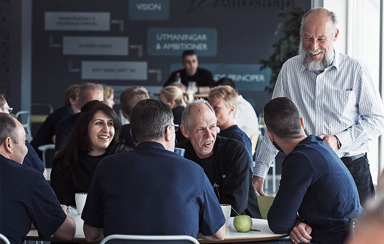 Employees talking in the cafeteria