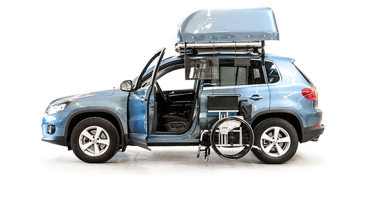 Chair Topper with wheelchair ready to be lifted into the roofbox. Chair Topper with wheelchair ready to be lifted into the roofbox.