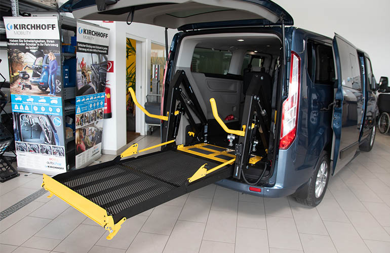 E-Series folding platform wheelchair lift in a Ford Custom.