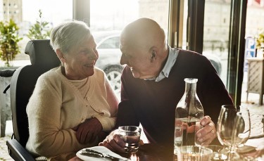 Happy elderly couple at a restaurant.